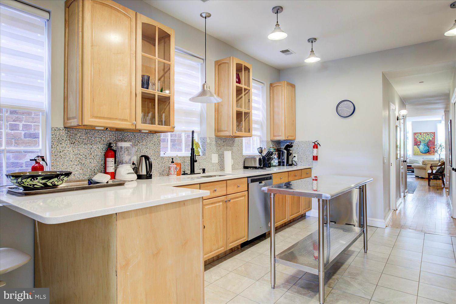 1118 F Street Northeast Washington, DC 20002 - Photo 12 of 62 a kitchen with stainless steel appliances granite countertop a sink and cabinets