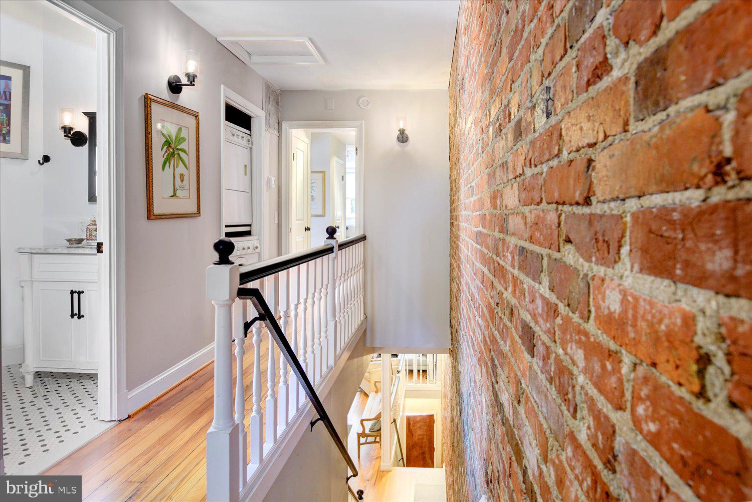 1118 F Street Northeast Washington, DC 20002 - Photo 17 of 62 a view of a hallway with wooden floor and staircase