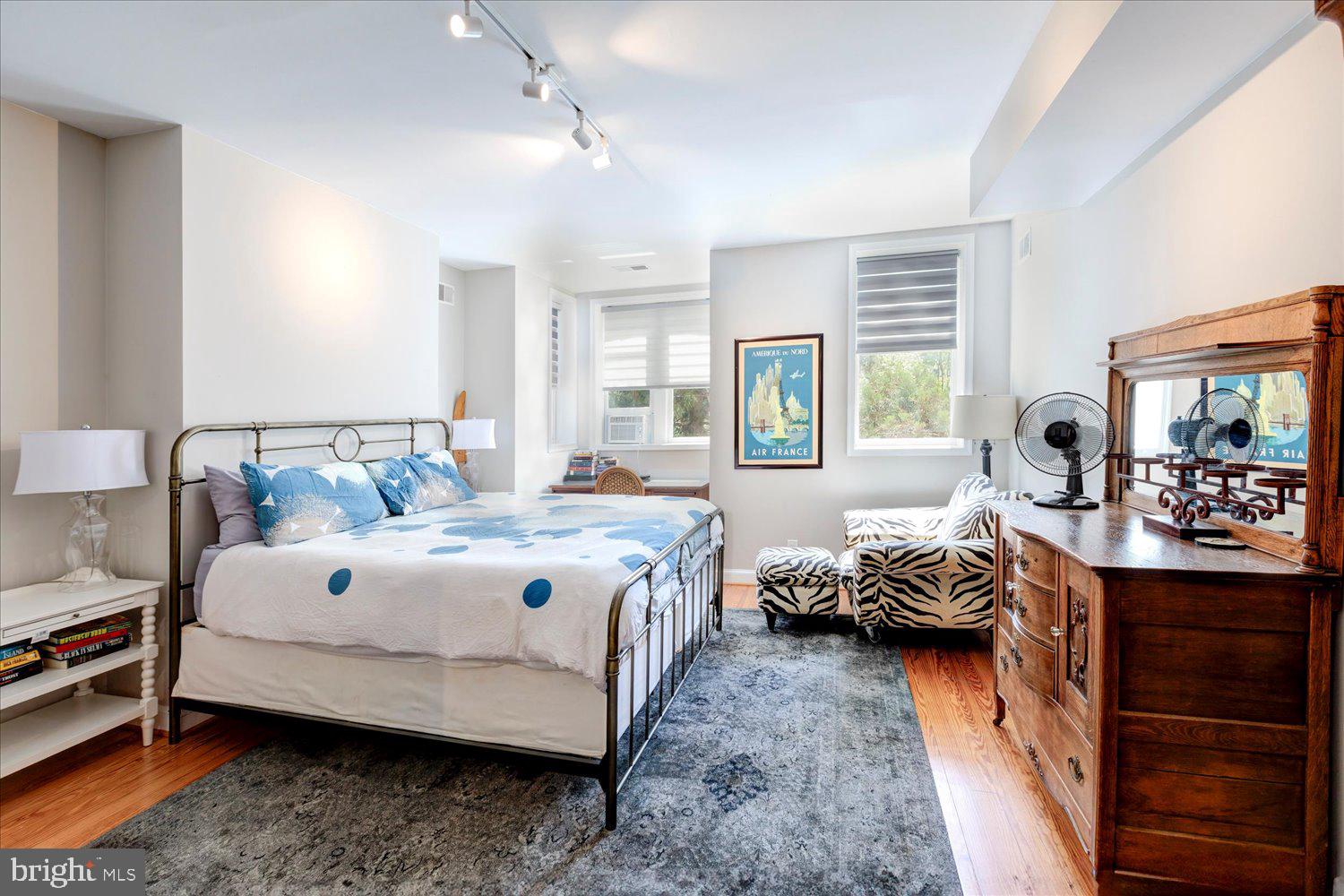 1118 F Street Northeast Washington, DC 20002 - Photo 18 of 62 a spacious bedroom with a bed and wooden floor