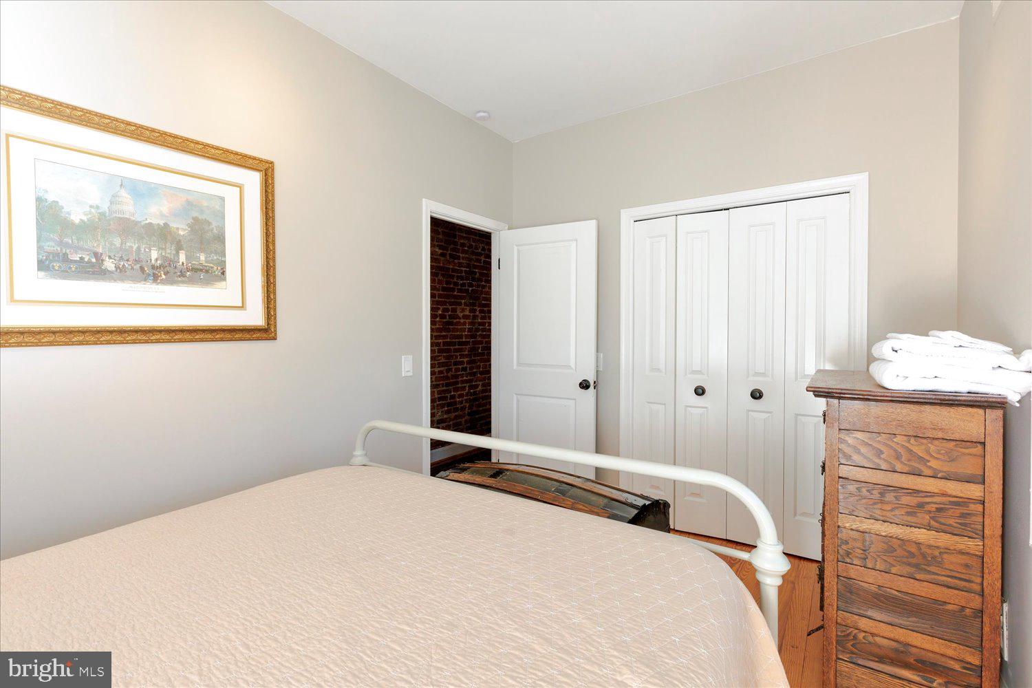 1118 F Street Northeast Washington, DC 20002 - Photo 25 of 62 a bedroom with a bed and a window
