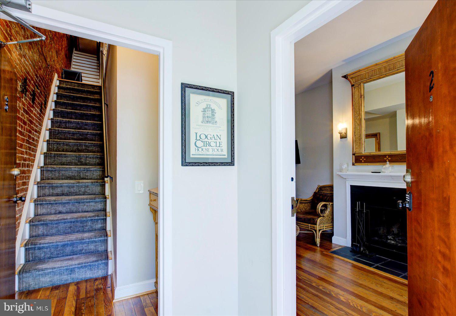 1118 F Street Northeast Washington, DC 20002 - Photo 3 of 62 a view of a hallway with wooden floor and staircase