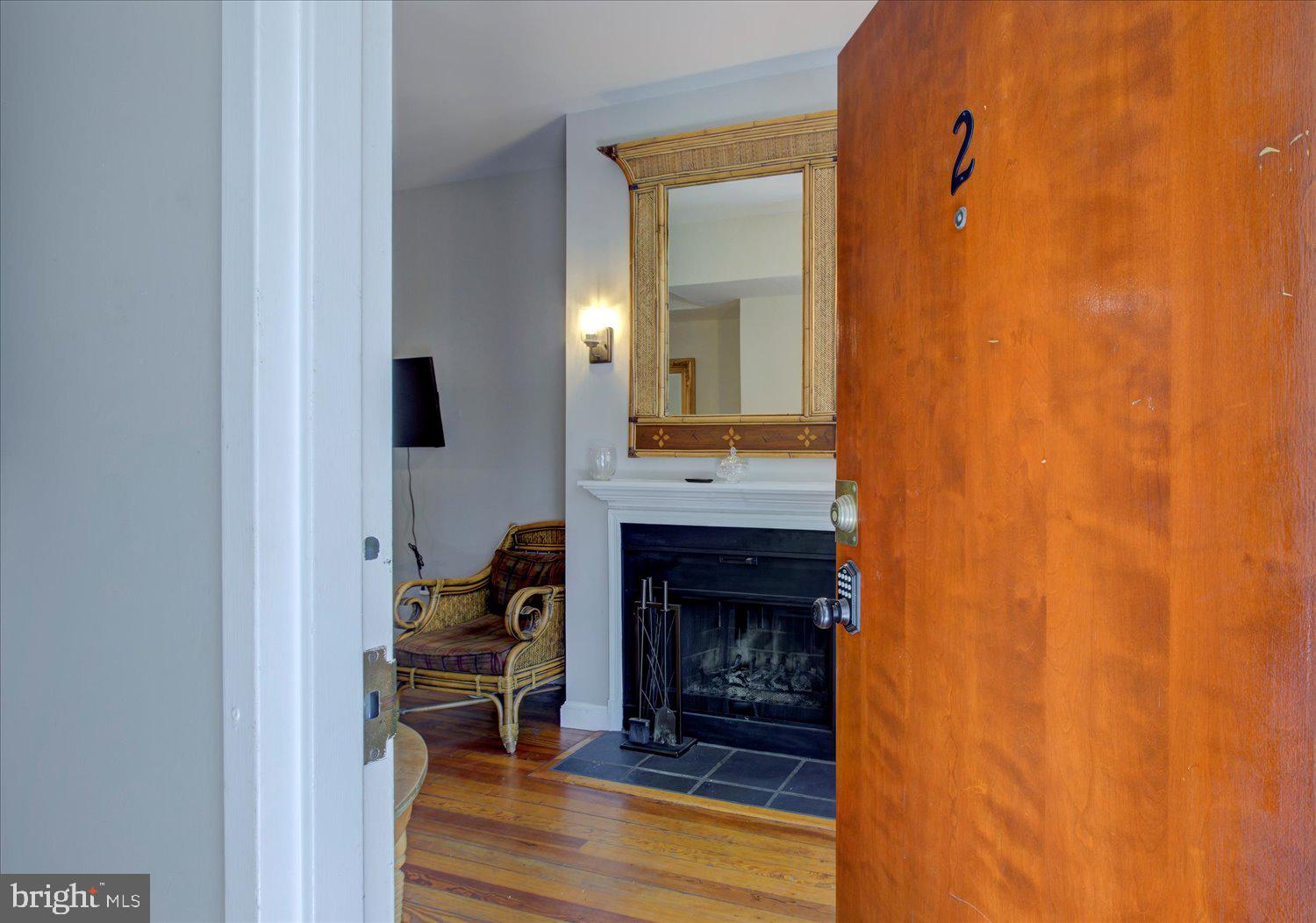 1118 F Street Northeast Washington, DC 20002 - Photo 32 of 62 a living room with a fireplace and a wooden floor