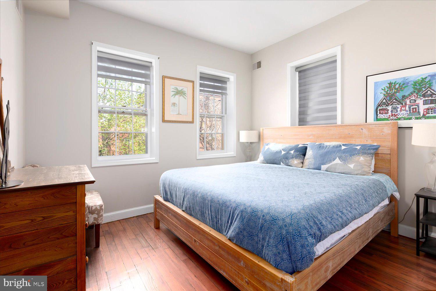 1118 F Street Northeast Washington, DC 20002 - Photo 39 of 62 a bed sitting in a bedroom next to a window