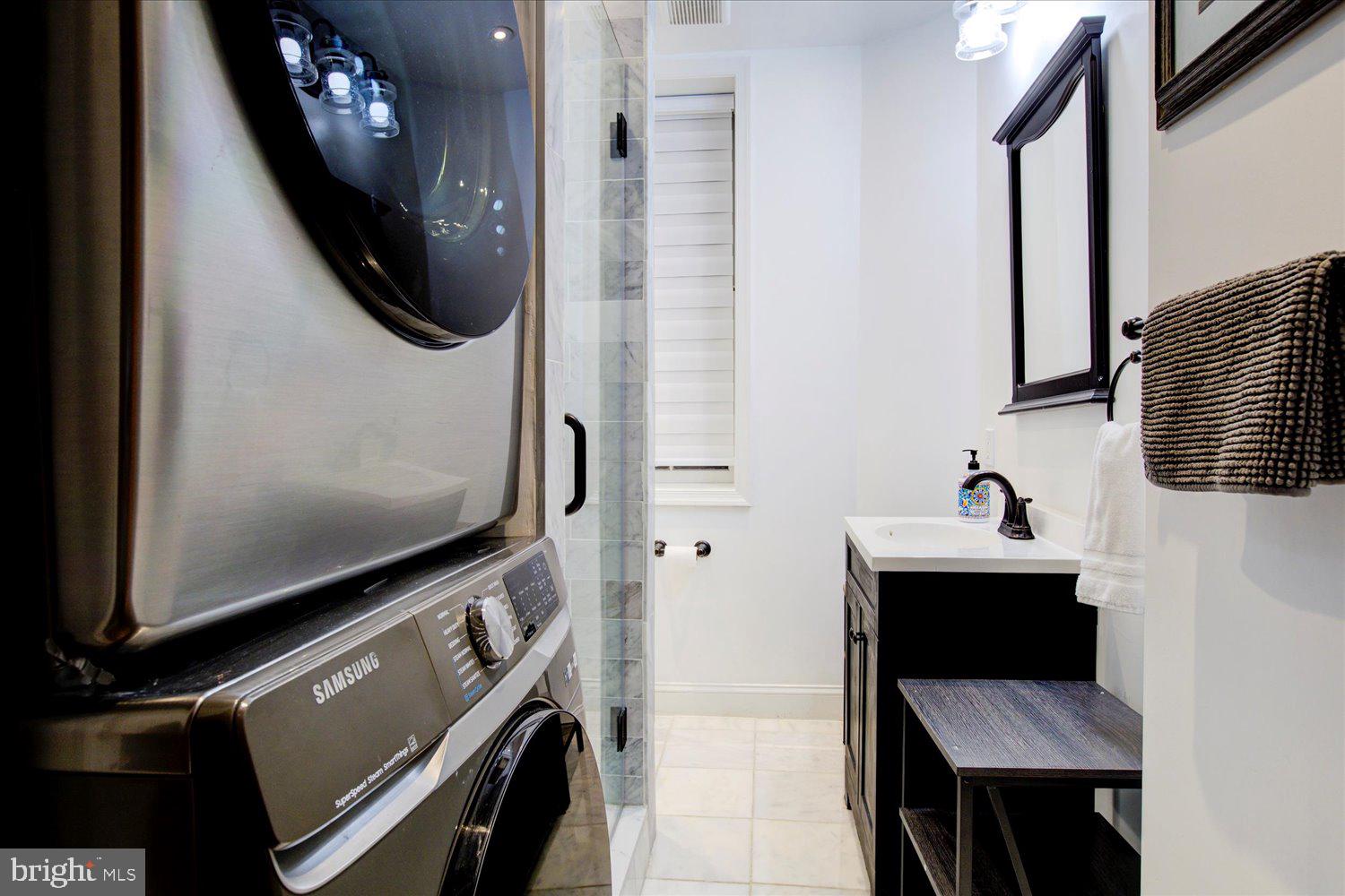 1118 F Street Northeast Washington, DC 20002 - Photo 42 of 62 a bathroom with a sink a toilet and mirror