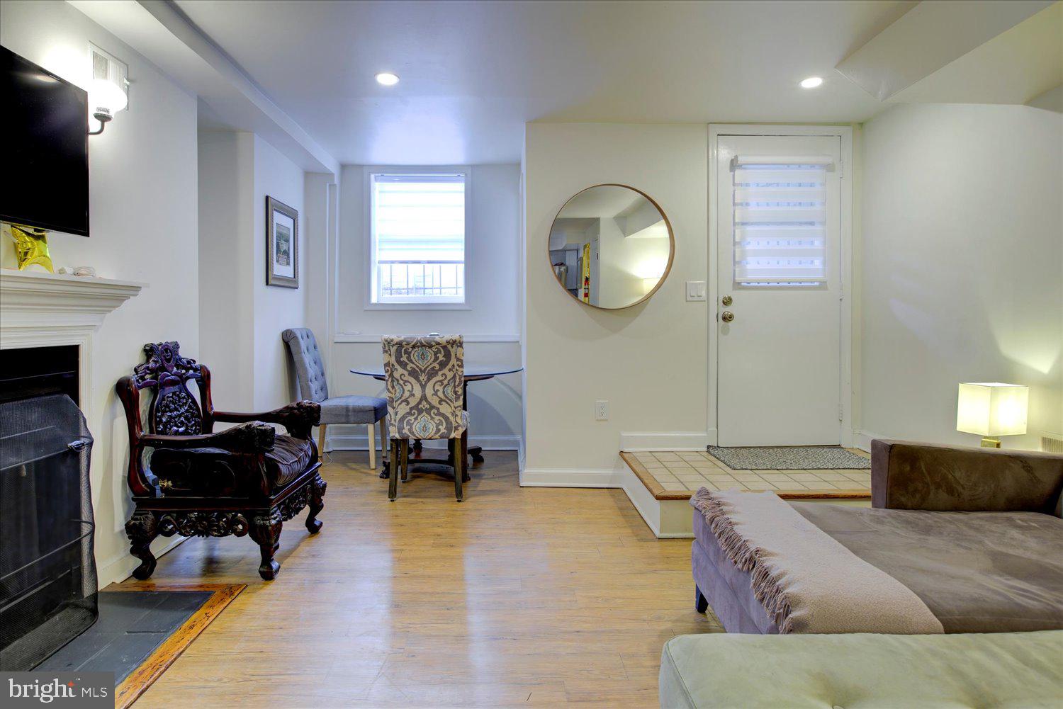 1118 F Street Northeast Washington, DC 20002 - Photo 52 of 62 a living room with furniture and a flat screen tv