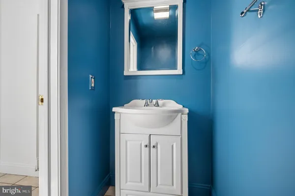 a bathroom with a sink and mirror