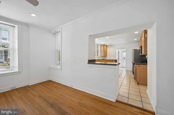 a view of a kitchen cabinets and wooden floor