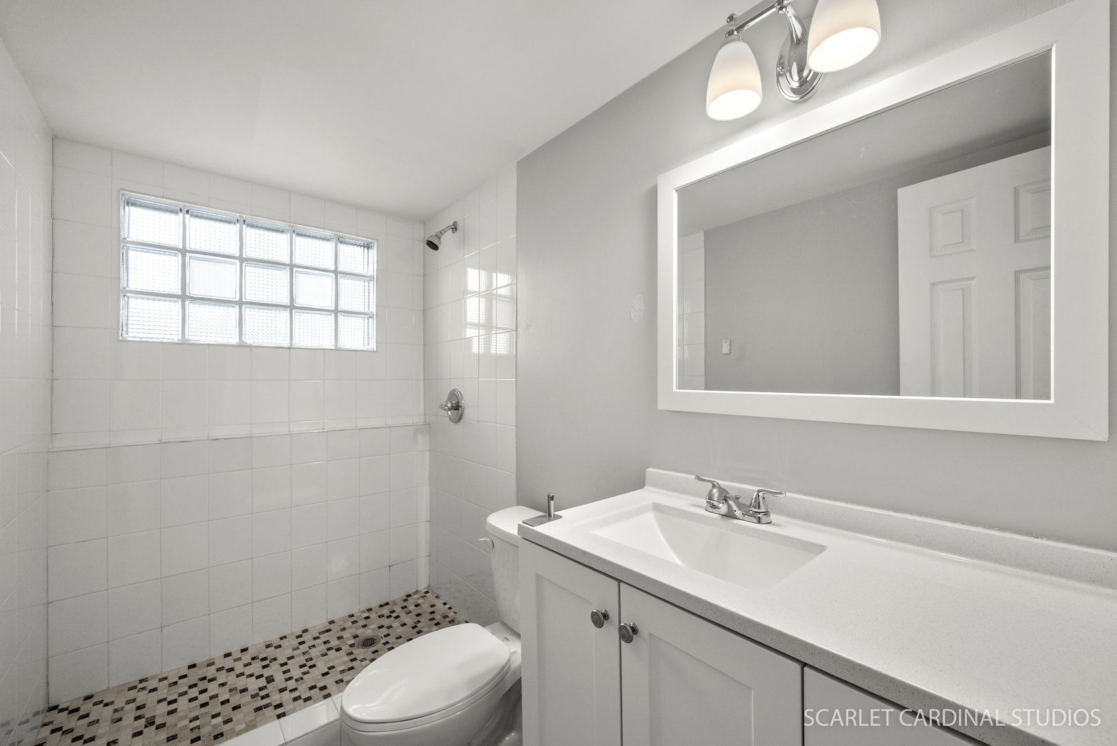1445 North Webster Street Naperville, IL 60563 - Photo 12 of 16 a bathroom with a sink a toilet a window and vanity