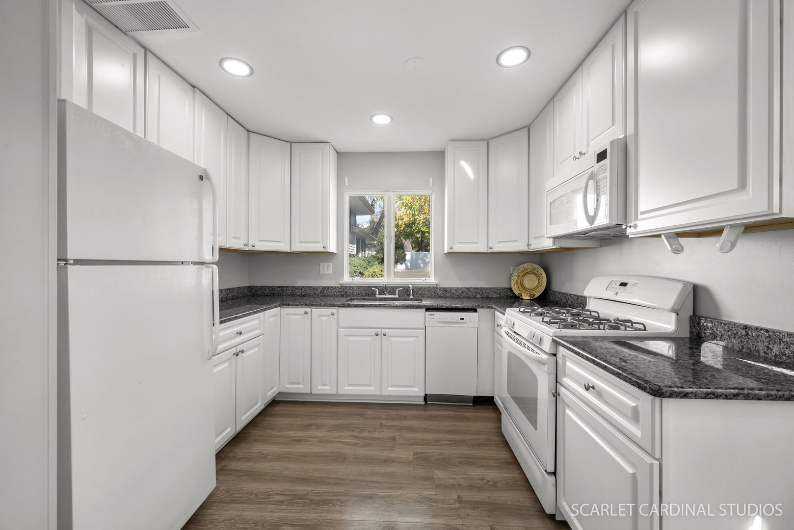 1445 North Webster Street Naperville, IL 60563 - Photo 5 of 16 a kitchen with stainless steel appliances granite countertop a sink stove and refrigerator