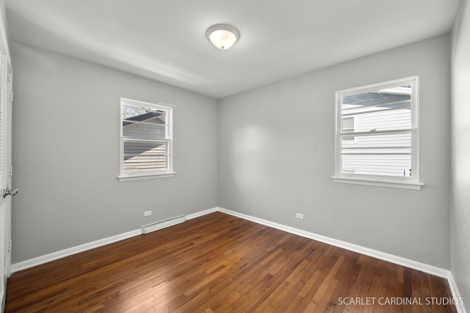 1445 North Webster Street Naperville, IL 60563 - Photo 9 of 16 an empty room with wooden floor and windows