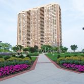 a view of flower garden in front of a building