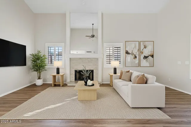 a living room with furniture and a fireplace