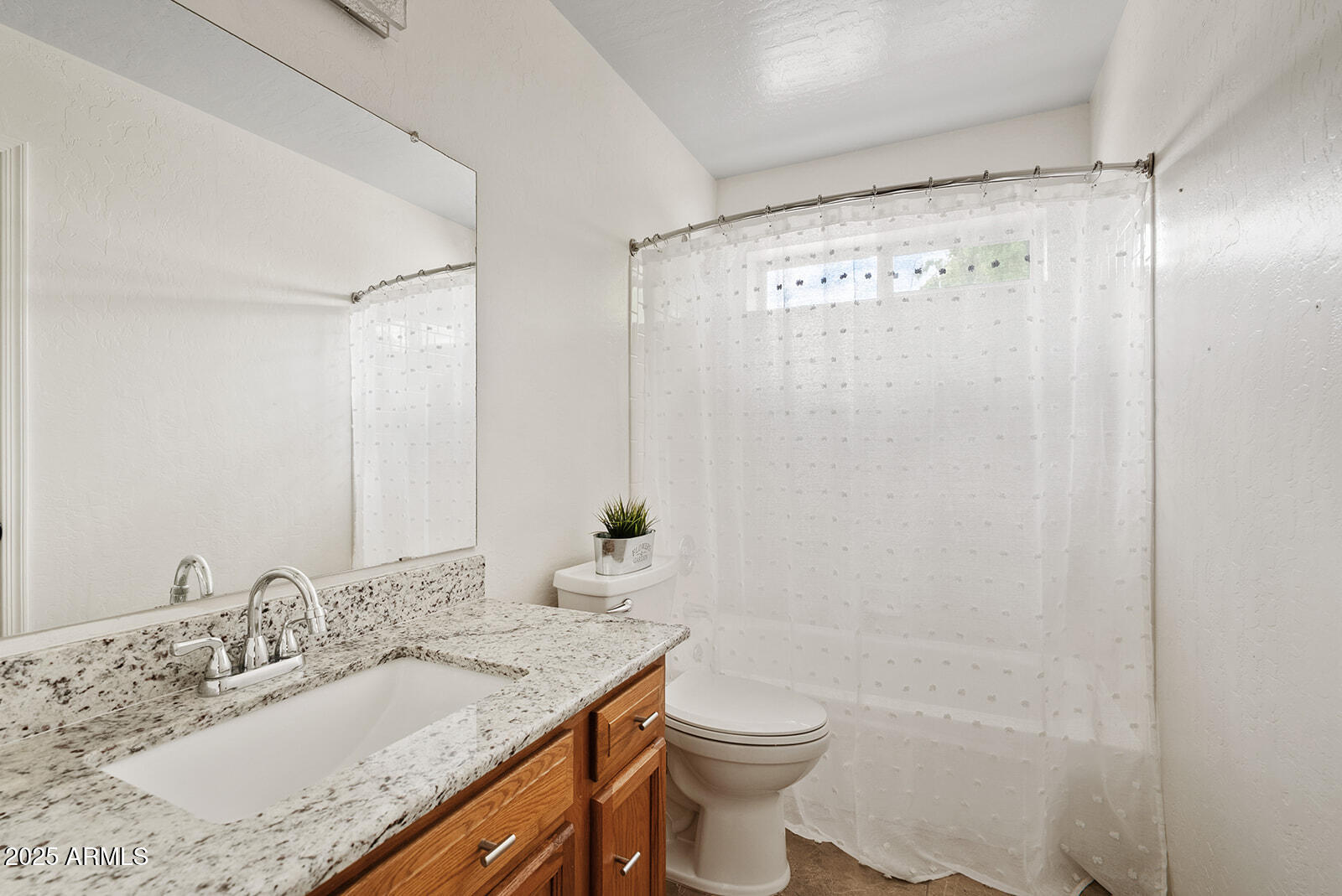 861 West Shellfish Drive Gilbert, AZ 85233 - Photo 22 of 32 a bathroom with a granite countertop sink toilet and shower