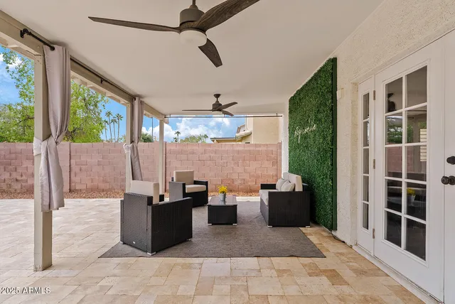 a wooden bench sitting in front of a building