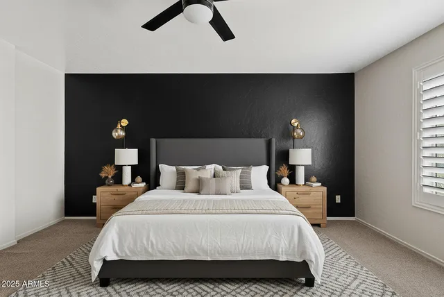 a bedroom with a bed and lamp