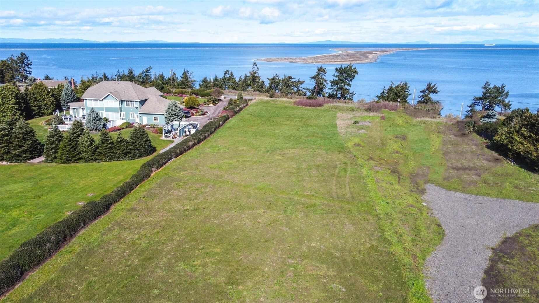 9999 Marine Drive Sequim, WA 98382 - Photo 1 of 20 a view of a swimming pool with a yard