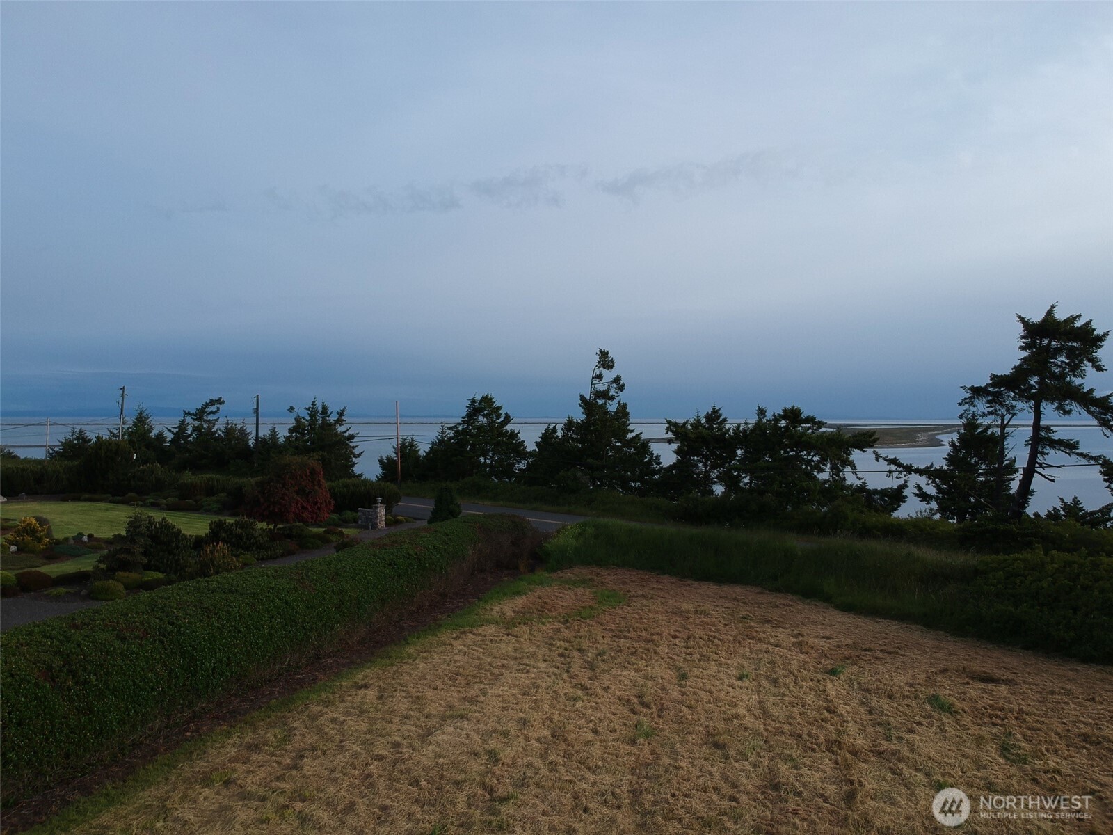 9999 Marine Drive Sequim, WA 98382 - Photo 12 of 20 a view of a golf course with a lake