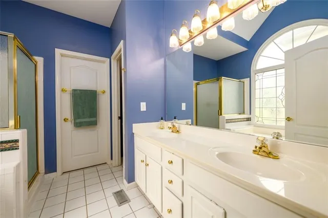 a bathroom with a bathtub and a shower