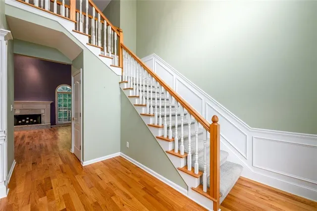 a view of an entryway with wooden floor