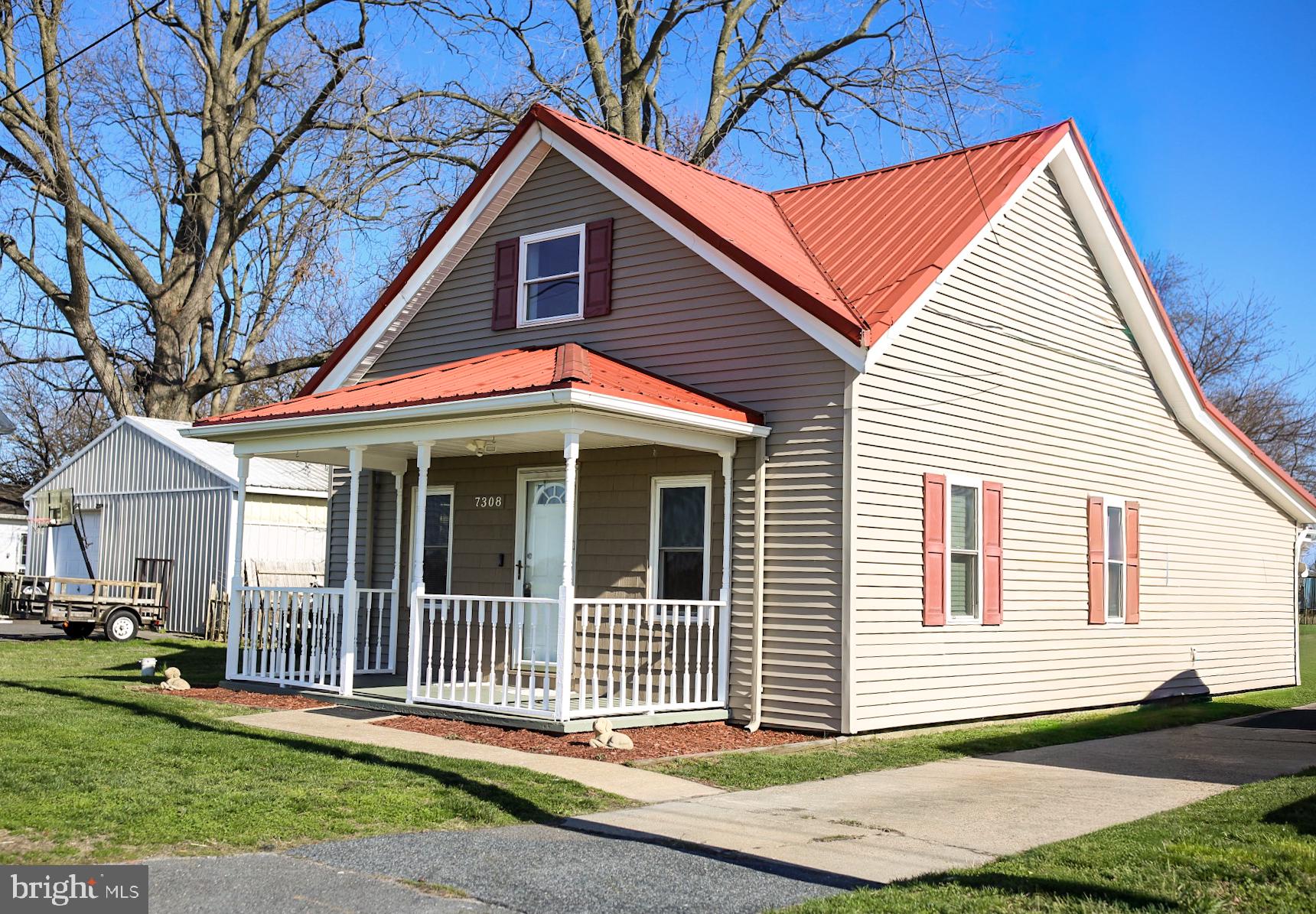 7308 Federalsburg Road Bridgeville, DE 19933 - Photo 1 of 24 a front view of a house with a yard