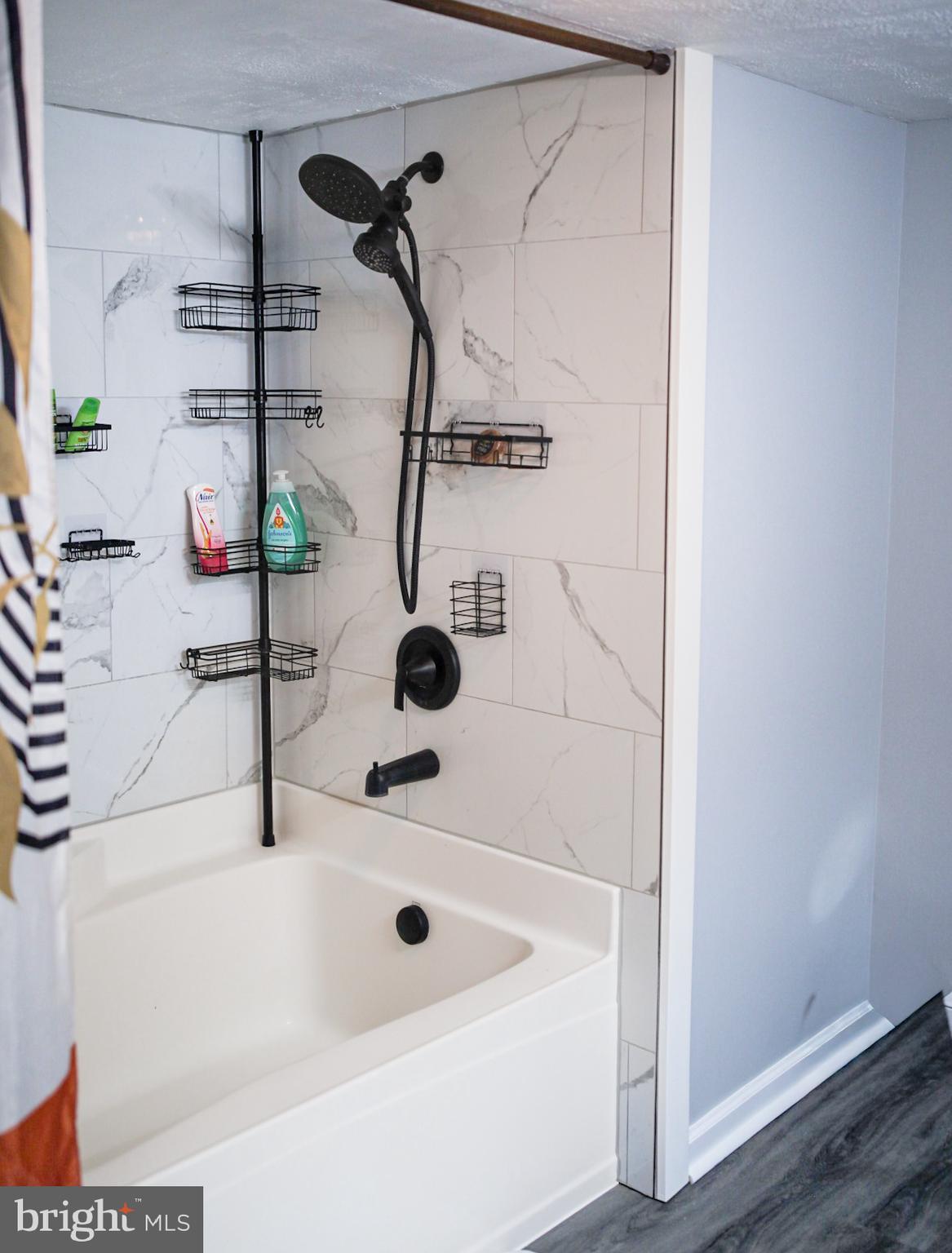 7308 Federalsburg Road Bridgeville, DE 19933 - Photo 13 of 24 a bathroom with a tub and shower