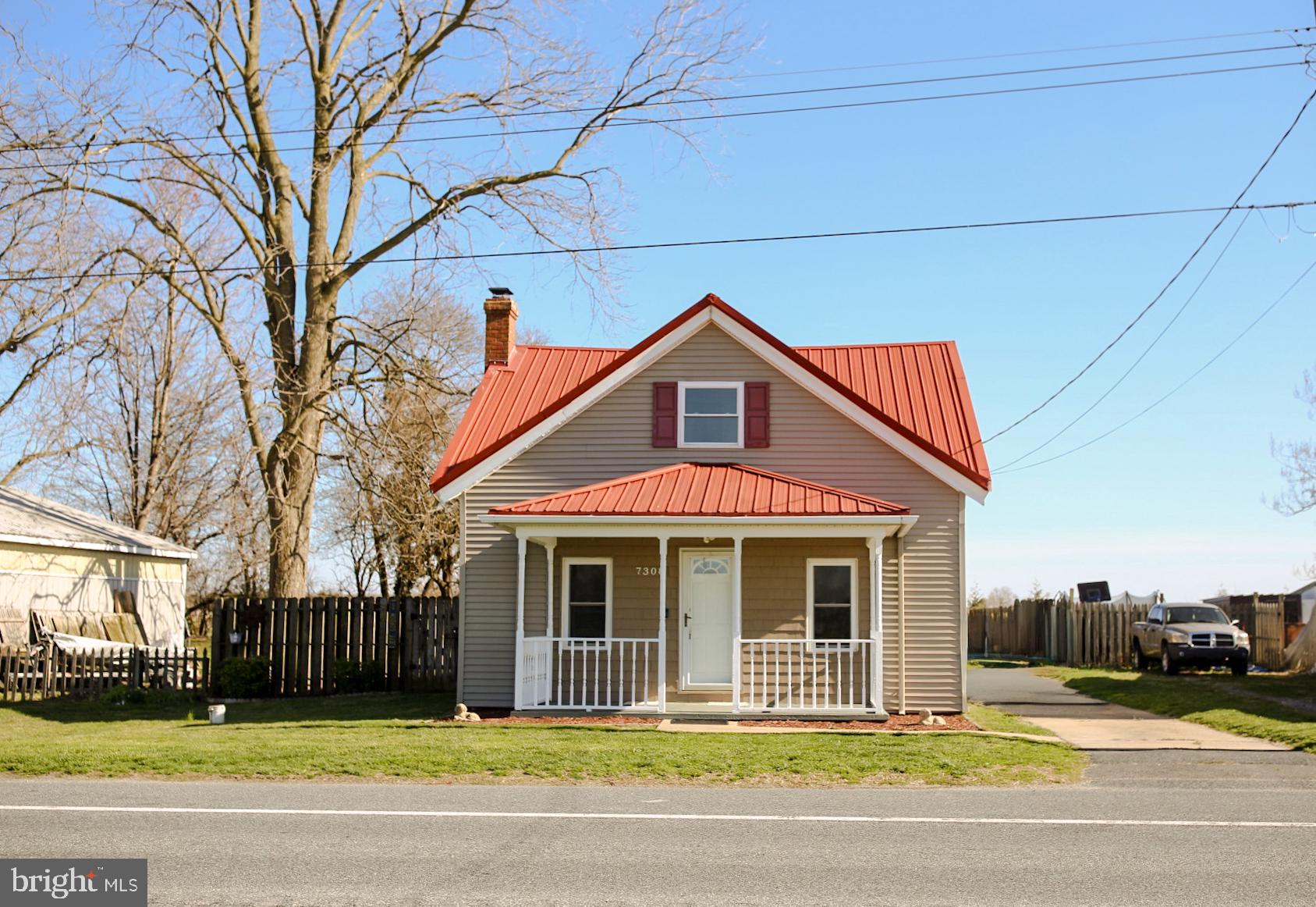 7308 Federalsburg Road Bridgeville, DE 19933 - Photo 2 of 24 a front view of a house with a yard