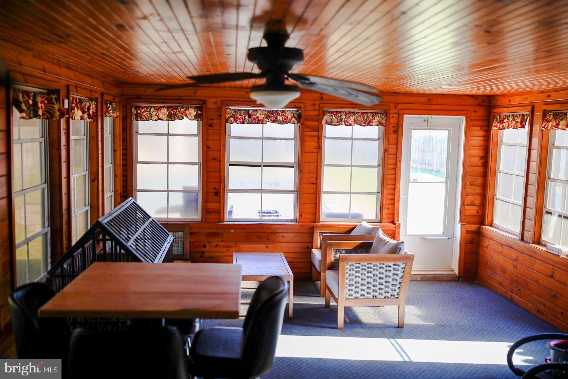 7308 Federalsburg Road Bridgeville, DE 19933 - Photo 21 of 24 a dining room with furniture a chandelier and wooden floor