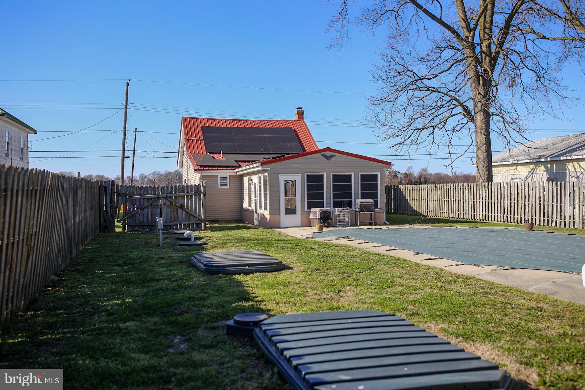 7308 Federalsburg Road Bridgeville, DE 19933 - Photo 23 of 24 a view of a house with backyard and wooden fence