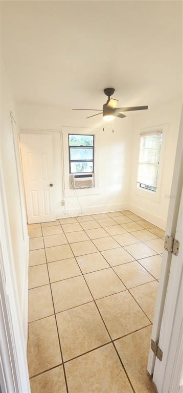 301 Ave B Southeast, Unit 4 Winter Haven, FL 33880 - Photo 11 of 16 a view of a livingroom with an empty space and a window