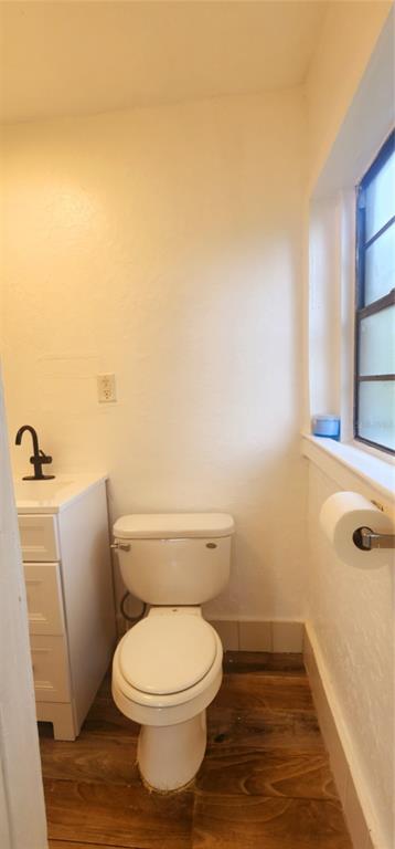 301 Ave B Southeast, Unit 4 Winter Haven, FL 33880 - Photo 15 of 16 a white toilet sitting next to a bath tub