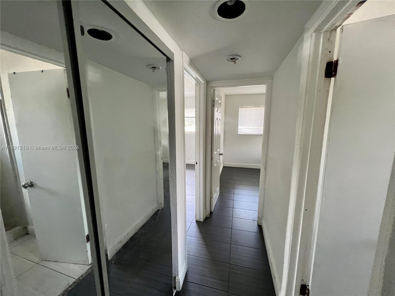 37 Southwest 14th Street, Unit 16 Dania Beach, FL 33004 - Photo 7 of 11 a view of a hallway