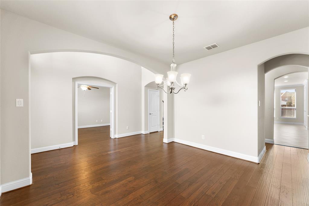 1425 Barrolo Drive McLendon-Chisholm, TX 75032 - Photo 11 of 38 a view of empty room with wooden floor and ceiling fan