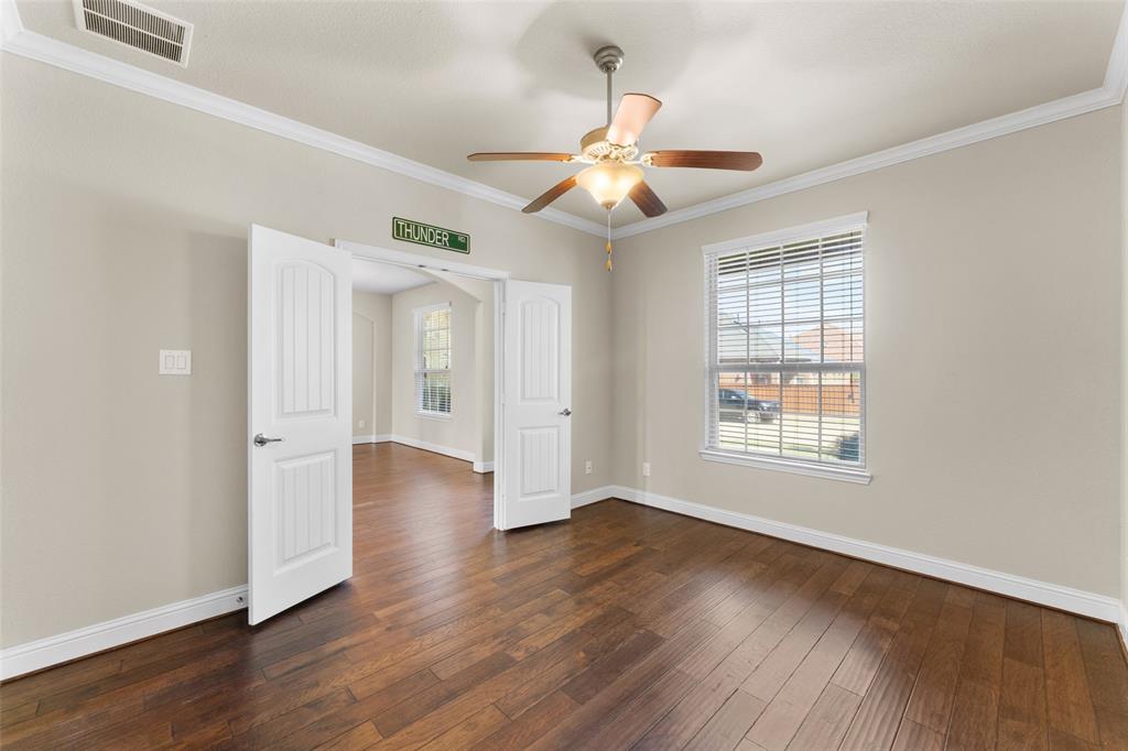 1425 Barrolo Drive McLendon-Chisholm, TX 75032 - Photo 12 of 38 a view of an empty room with wooden floor and a window