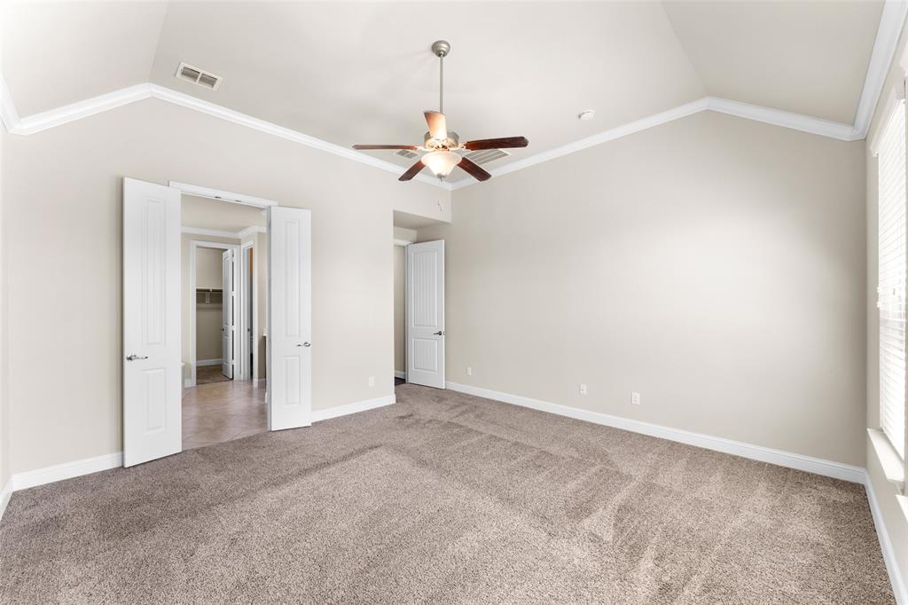 1425 Barrolo Drive McLendon-Chisholm, TX 75032 - Photo 20 of 38 a view of a room with a ceiling fan and a chandelier fan