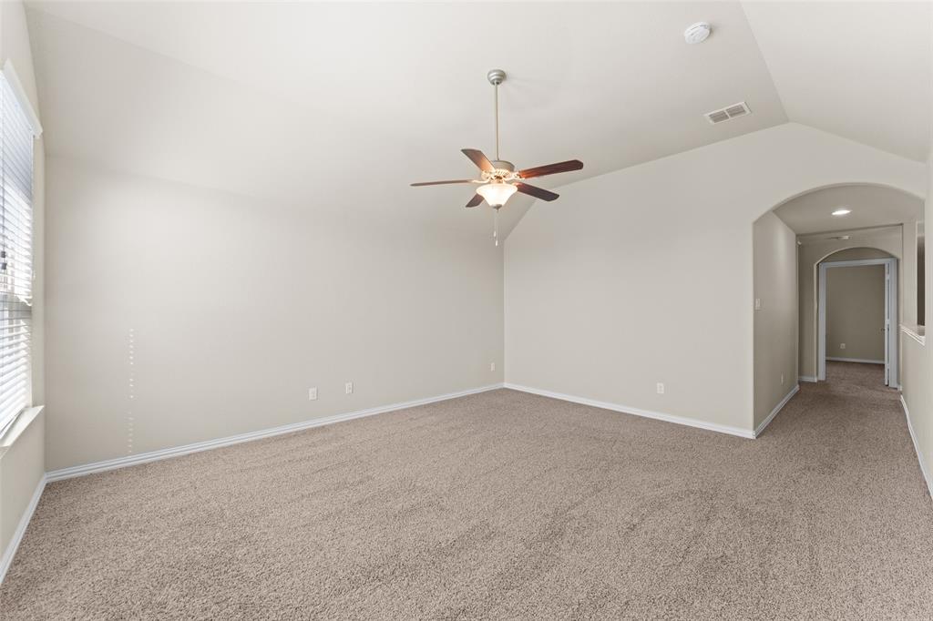 1425 Barrolo Drive McLendon-Chisholm, TX 75032 - Photo 30 of 38 an empty room with a ceiling fan and a window