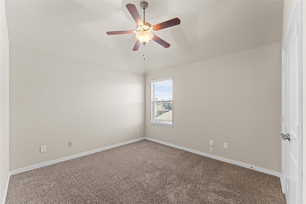 1425 Barrolo Drive McLendon-Chisholm, TX 75032 - Photo 31 of 38 an empty room with a window and a fan