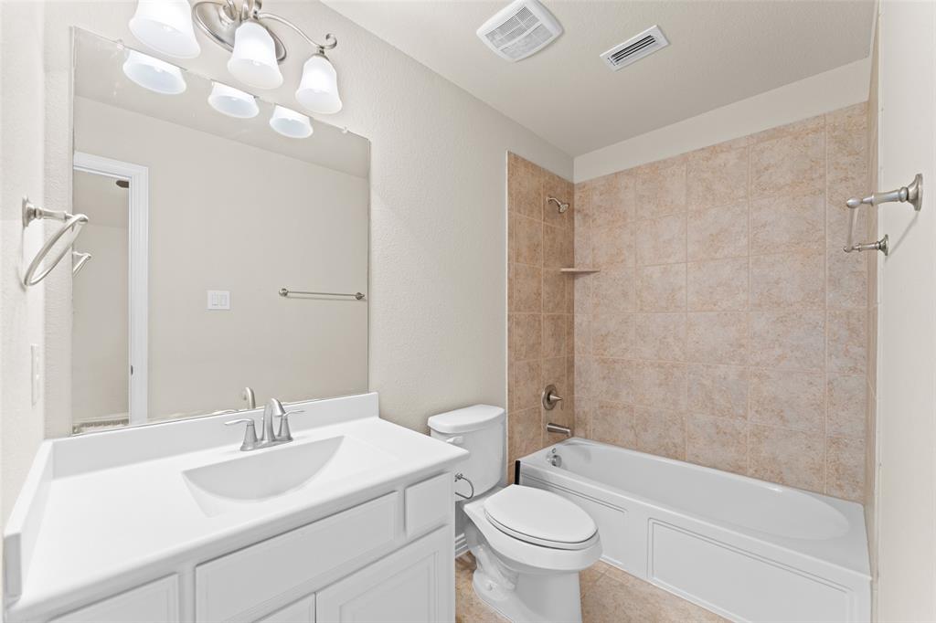 1425 Barrolo Drive McLendon-Chisholm, TX 75032 - Photo 33 of 38 a bathroom with a sink toilet and shower