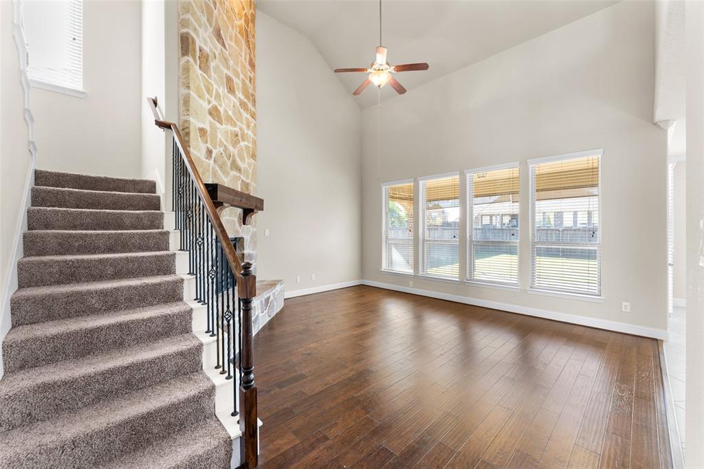 1425 Barrolo Drive McLendon-Chisholm, TX 75032 - Photo 6 of 38 a view of an empty room with wooden floor and fan