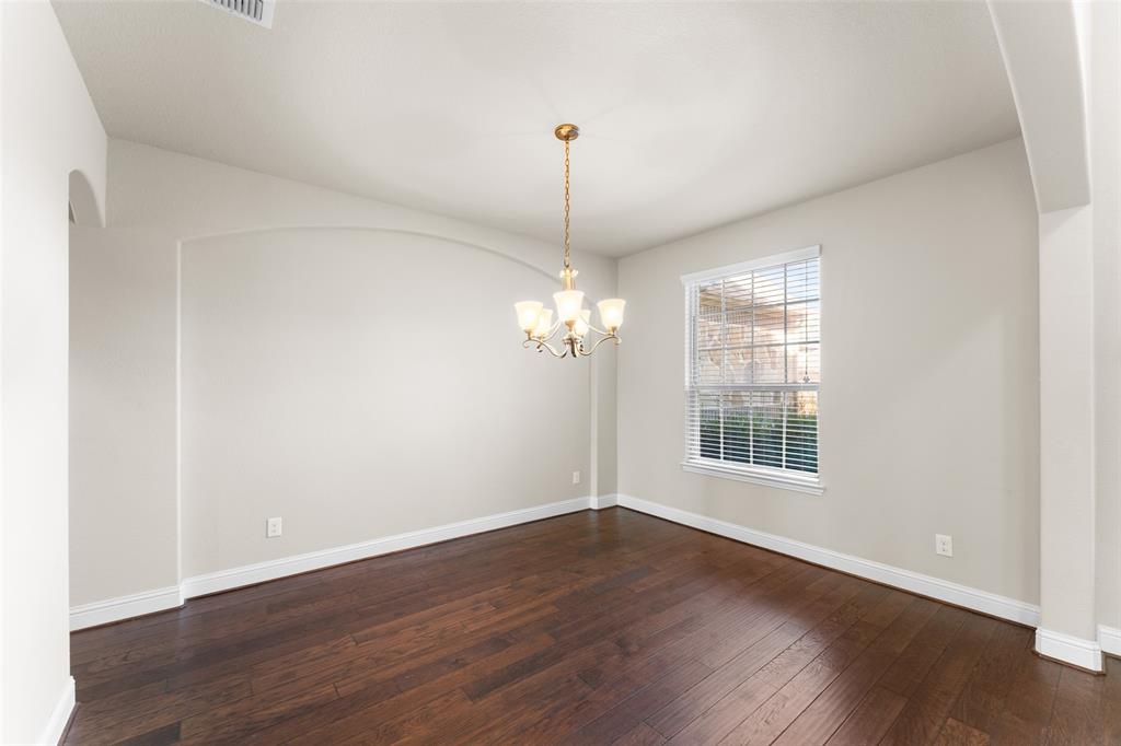 1425 Barrolo Drive McLendon-Chisholm, TX 75032 - Photo 9 of 38 wooden floor in an empty room with a window
