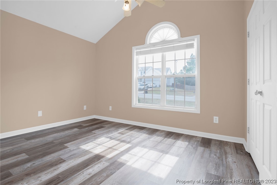 66 Pender Road Spring Lake, NC 28390 - Photo 17 of 35 an empty room with wooden floor and windows