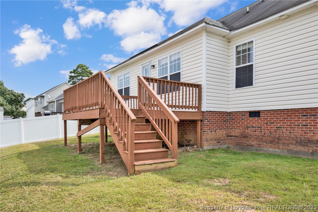 66 Pender Road Spring Lake, NC 28390 - Photo 32 of 35 a view of a house with a yard