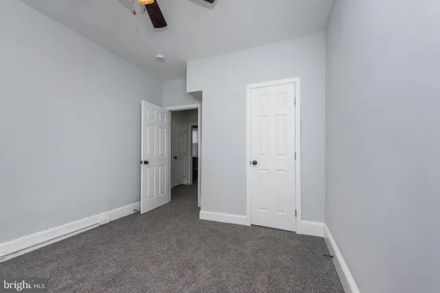 an empty room with a empty space and windows