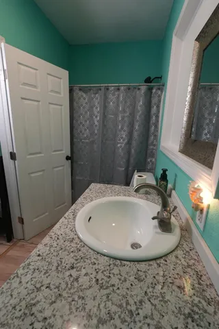 a bathroom with a sink and a mirror