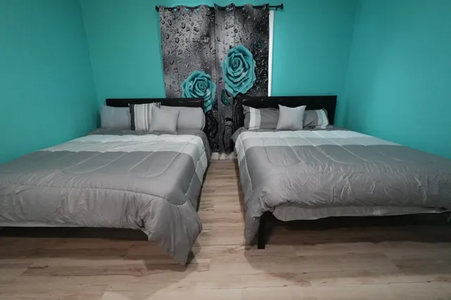 a bedroom with a bed and a table