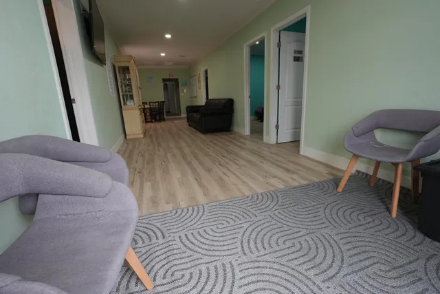 a bed room with a bed and a chair