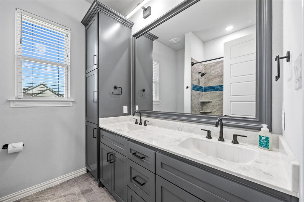 5707 Florance Road Northlake, TX 76226 - Photo 16 of 31 a bathroom with a sink and a mirror