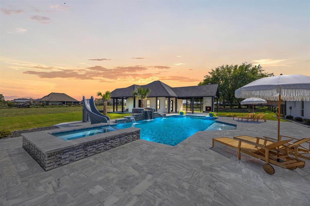 5707 Florance Road Northlake, TX 76226 - Photo 2 of 31 a view of a swimming pool with a lounge chair