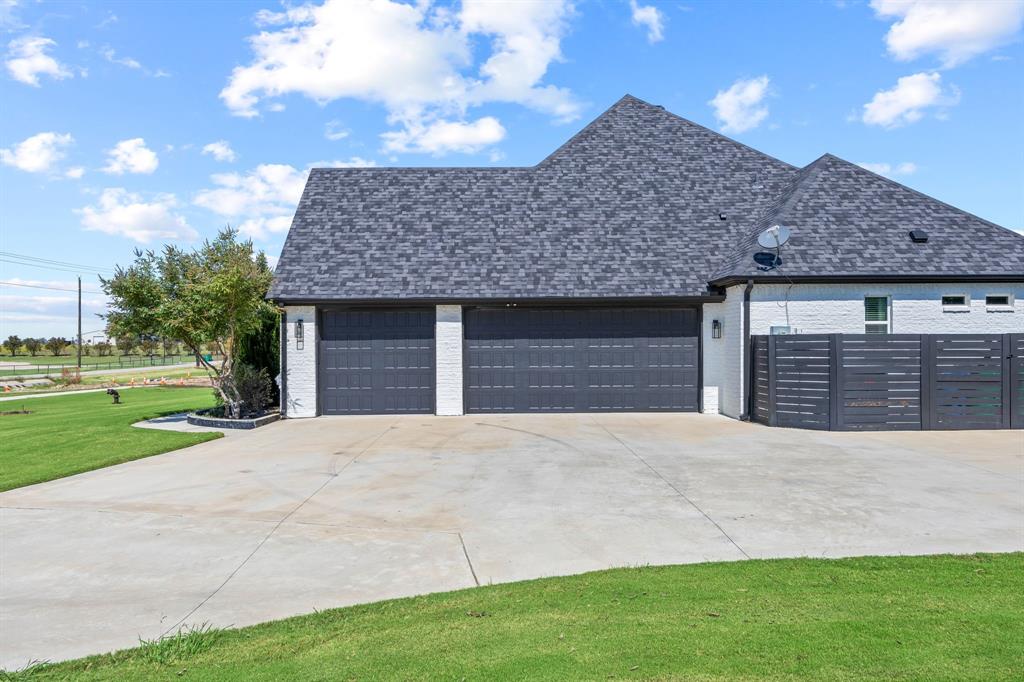 5707 Florance Road Northlake, TX 76226 - Photo 30 of 31 a front view of a house with a yard and garage