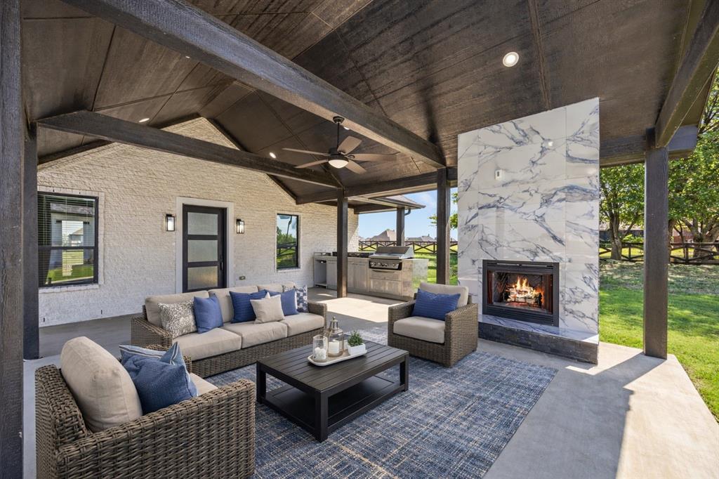 5707 Florance Road Northlake, TX 76226 - Photo 4 of 31 a living room with furniture and a fireplace