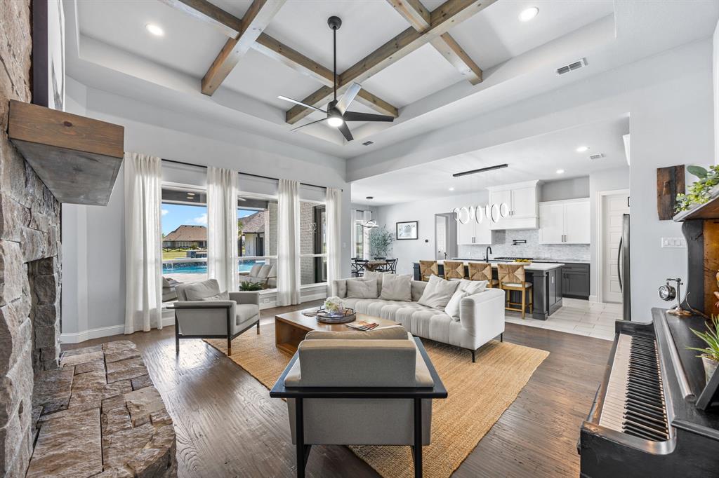 5707 Florance Road Northlake, TX 76226 - Photo 6 of 31 a living room with furniture fireplace and a flat screen tv
